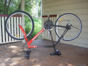 004 Repco Typhoon bike upside down with treaded mountain bike tyre and slick road tyre