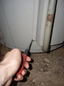 2009-09-10-hot-water-system2 Open the cover that protects the thermostat from damage. This may need a screwdriver.