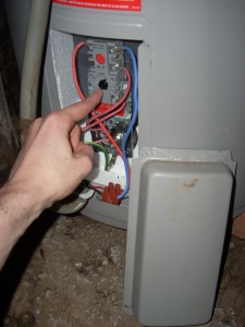 2009-09-10-hot-water-system4 Find the thermostat dial and adjust down to a temperature that is just hot enough for your purposes. This may need a few days of experimentation.