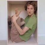 Stuart McMillen inside a box.